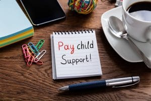 Pay Child Support Written On Notepad | Melissa Graham-Hurd & Associates